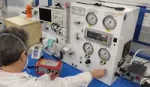 A scientist testing a ventilator at one of the companies producing equipment for the UK Ventilator Challenge consortium.