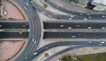 An aerial view of cars driving around a motorway junction