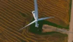 An aerial photograph of a wind turbine.